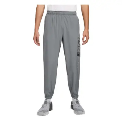 Pánské tréninkové kalhoty NIKE DF FORM GFX PANT TPR