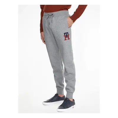 Světle šedé unisex žíhané tepláky Tommy Hilfiger - Pánské