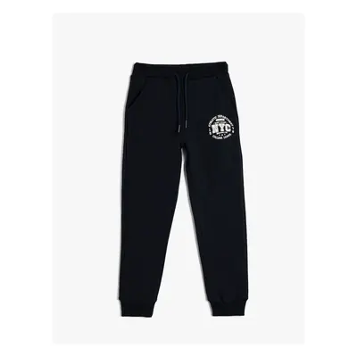 Koton Jogger Sweatpants with Tie Waist Printed Detail and Pockets