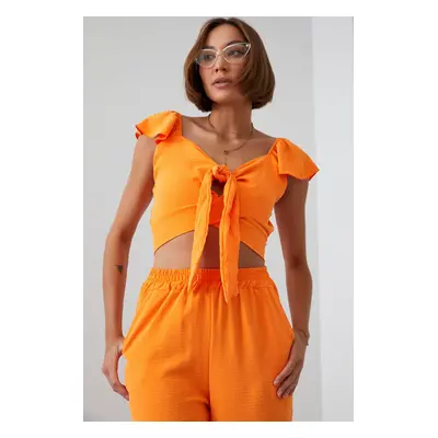 Set crop top + kalhoty se širokými nohavicemi Barva: Oranžová