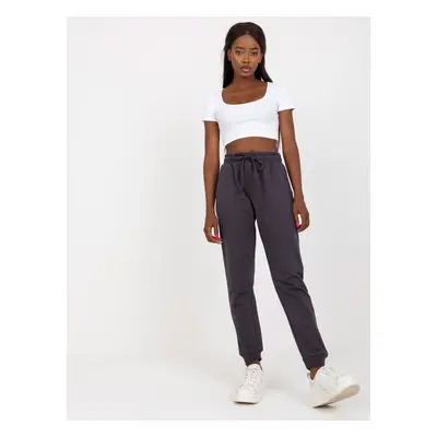 Graphite sweatpants tied at the waist