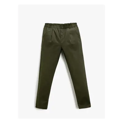 Koton Fabric Carrot Trousers with Button Detail Pocket.