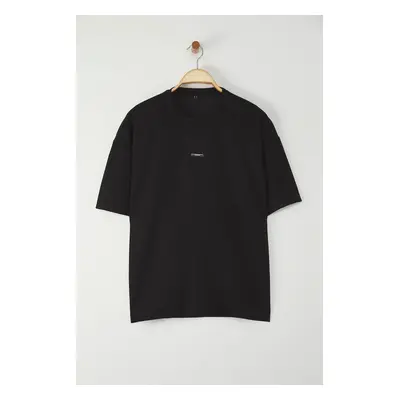 Trendyol Black Oversize/Wide Cut Metal Label Detail Soft Tissue Interlock Fabric T-Shirt