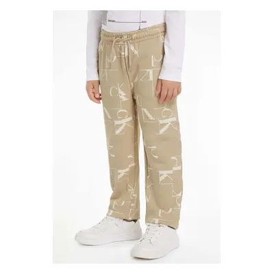 Dětské bavlněné tepláky Calvin Klein Jeans TERRY JOGGER béžová barva, IB0IB02124