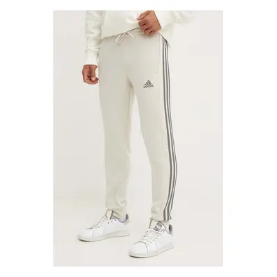 Tepláky adidas Essentials béžová barva, s aplikací, JG5952