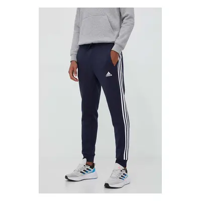 Tepláky adidas tmavomodrá barva, s aplikací, IJ6493