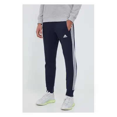 Bavlněné tepláky adidas tmavomodrá barva, s aplikací