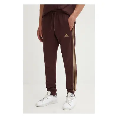 Bavlněné tepláky adidas Essentials hnědá barva, s aplikací, IW7681