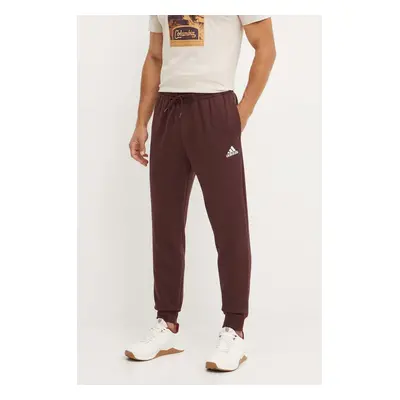 Tepláky adidas Essentials hnědá barva, s aplikací, IY9086