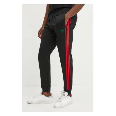 Tepláky adidas Originals SST TP černá barva, s aplikací, JP1225