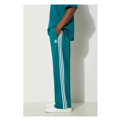 Tepláky adidas Originals Adicolor Baggy Fit Firebird Pant tyrkysová barva, s aplikací, IZ2473