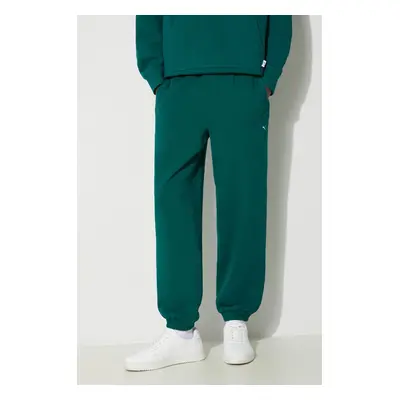 Bavlněné tepláky Puma MMQ Sweatpants zelená barva, 624007