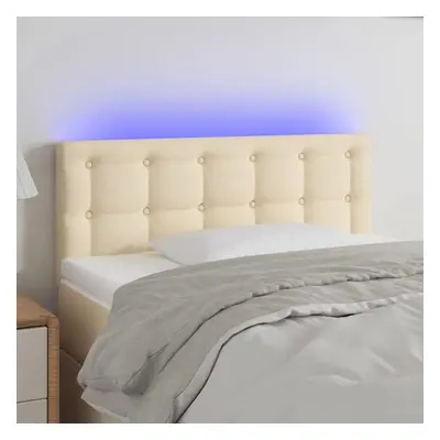 Čelo postele s LED krémové 100x5x78/88 cm textil