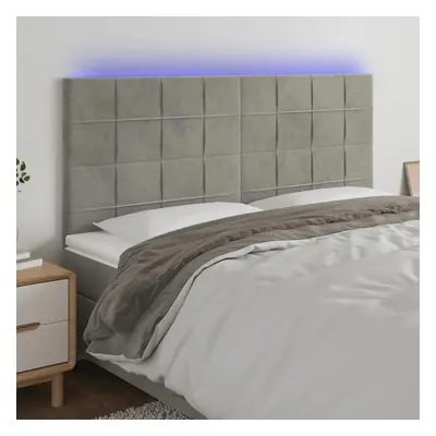 Čelo postele s LED světle šedé 160x5x118/128 cm samet