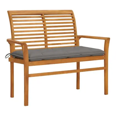 vidaXL Zahradní lavice s šedou poduškou 112 cm masivní teak