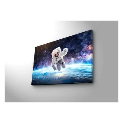 Wallity Obraz s LED osvětlením ASTRONAUT VE VESMÍRU 45 x 70 cm