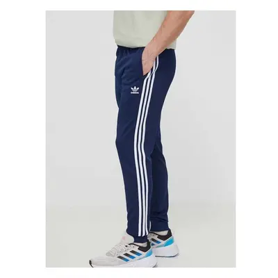 Tepláky adidas Originals Adicolor Classics SST tmavomodrá barva, s 89638876