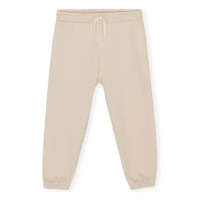 Dětské tepláky Konges Sløjd LOU SWEAT PANTS béžová barva, hladké 90940636