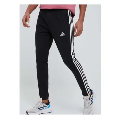 Tréninkové kalhoty adidas Essentials černá barva, s aplikací, IC0044 79112551