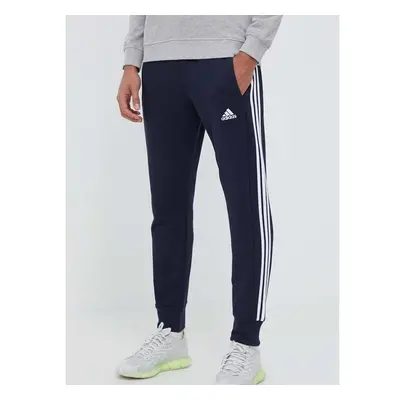 Bavlněné tepláky adidas tmavomodrá barva, s aplikací 81516970