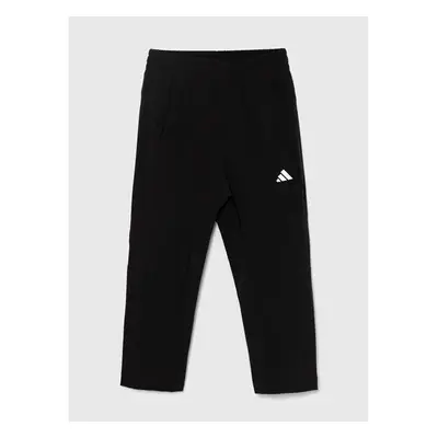 Dětské tepláky adidas černá barva, hladké 90023250