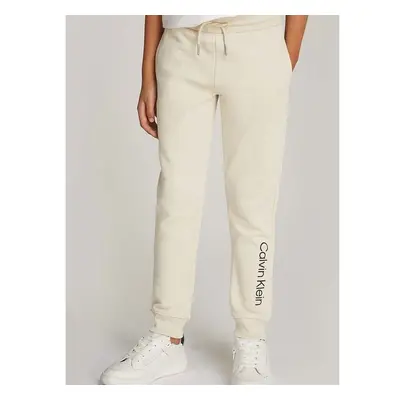 Dětské bavlněné tepláky Calvin Klein Jeans REGULAR JOGGER béžová barva 96045427