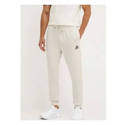 Tepláky adidas Essentials béžová barva, hladké, JH1039 96045136