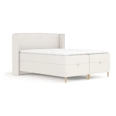 Krémová boxspring postel s úložným prostorem 180x200 cm Monpelli – Maison de Rêve